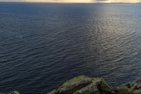 Neist Point at sunset, lighthouse, dramatic cliffs. Isle of Skye Stock Photos