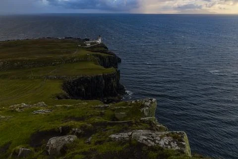 Neist Point at sunset, lighthouse, dramatic cliffs. Isle of Skye Stock Photos