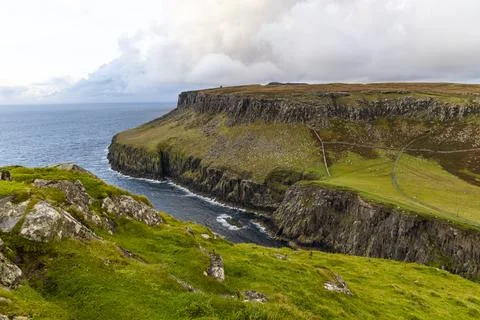 Neist Point at sunset, lighthouse, dramatic cliffs. Isle of Skye Stock Photos