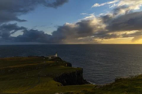 Neist Point at sunset, lighthouse, dramatic cliffs. Isle of Skye Stock Photos