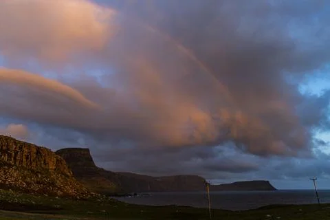Neist Point at sunset, lighthouse, dramatic cliffs. Isle of Skye Stock Photos