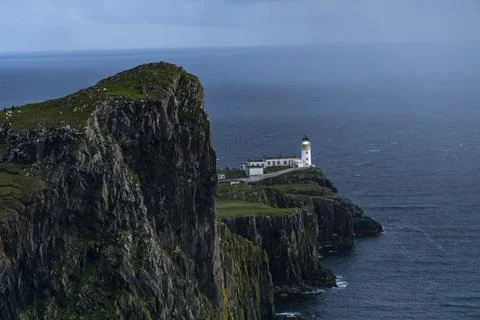Neist Point at sunset, lighthouse, dramatic cliffs. Isle of Skye Stock Photos