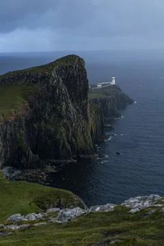 Neist Point at sunset, lighthouse, dramatic cliffs. Isle of Skye Stock Photos