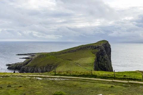 Neist Point at sunset, lighthouse, dramatic cliffs. Isle of Skye Stock Photos