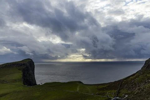 Neist Point at sunset, lighthouse, dramatic cliffs. Isle of Skye Stock Photos