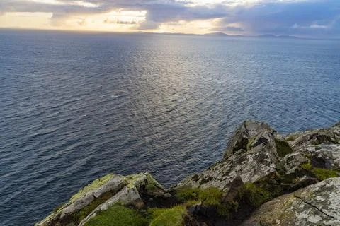 Neist Point at sunset, lighthouse, dramatic cliffs. Isle of Skye Stock Photos
