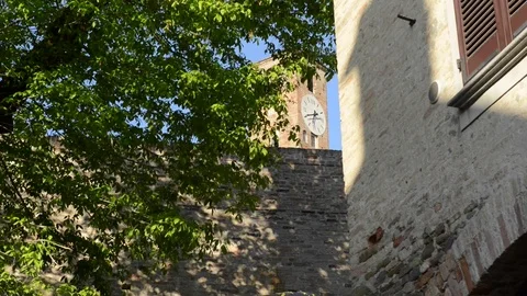 Neive, view of the clock tower from a small alley. Neive, Langhe, Italy Stock Footage 79276896