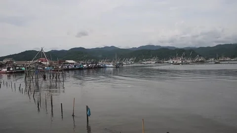 Nelayanfisherman's house on the beach Stock Footage 220755841
