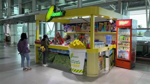 Nelson's Worker Serving Customers at Kota Kinabalu International Airport Stock Footage 228567740