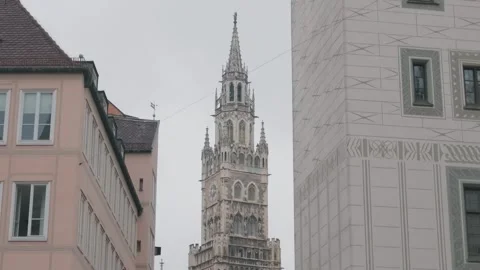Neo Gothic Clock Tower Framed by Building Facades, Munich, Elevated Shot Vídeo Stock 342724023