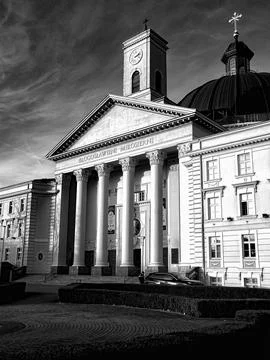 Neoclassical cathedral facade with clock tower Stock Photos
