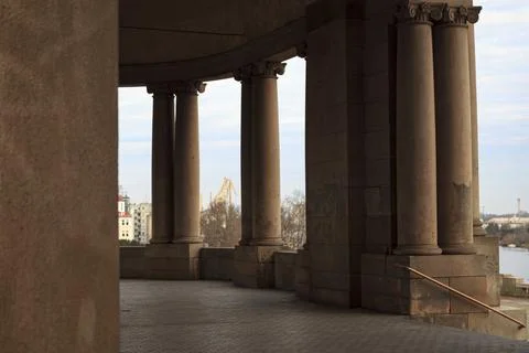 Neoclassical colonnade overlooking river Stock Photos