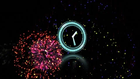 Neon blue digital clock ticking against fireworks exploding on black background Stock Footage 158400768
