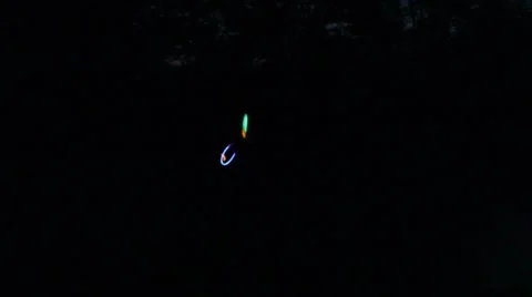 Neon circles spin and move against a black backdrop Stock Footage 40205525