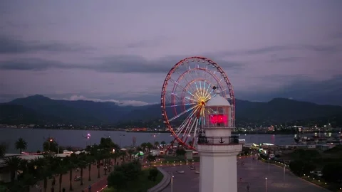 Neon colored lights flashing on the Ferris wheel. Stock Footage 237173154