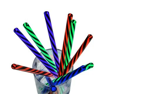 Neon colored plastic drinking straws placed in a glass Stock Photos