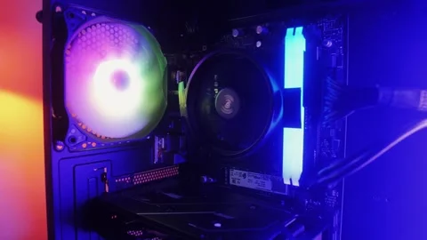 Neon colorful pc processor cooler rotating close-up. Neon system unit, computer Stock Footage 272477691