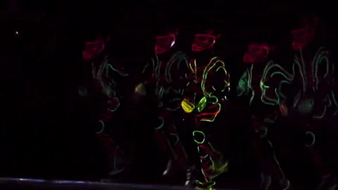 Neon dancers in the dark. Stock Footage 143624148