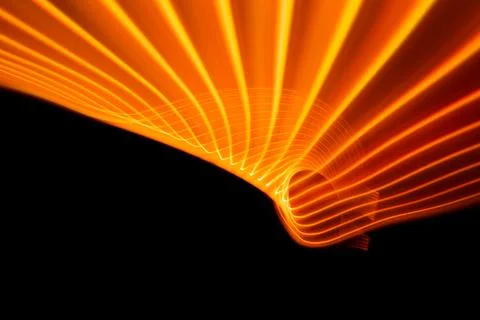 Neon design elements orange warm lights glow and flash technology background. 写真素材