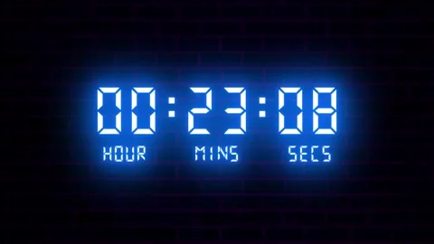 Neon Digital Countdown Timer with Hour Minute Second Display on Brick Wall Video stock 330789494