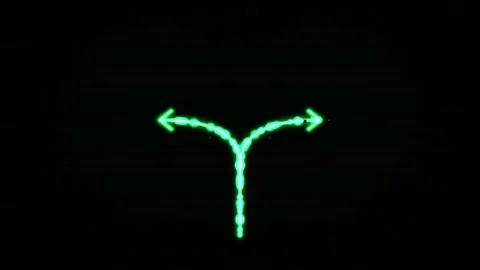 Neon green arrow splits two directions against black background for choice .. Video stock 344685176