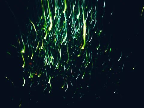 Neon green lights falling firework sparkles lines 写真素材