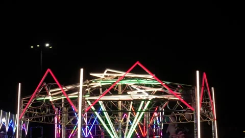 Neon illuminated fairground light 스톡 동영상 329379548