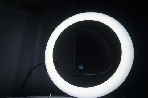 Neon light circle in black hall room, futuristic concept, abstract geometri.. Stock Photos