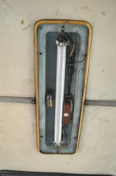 A neon light inside of an old bus Stock Photos