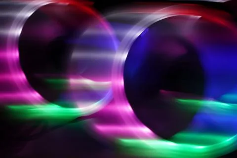 Neon light pattern. Abstract circles isolated on a black background. Luminous Stock Photos