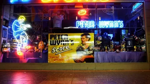 Neon light sign retail storefront at night 4k Stock Footage 99451467