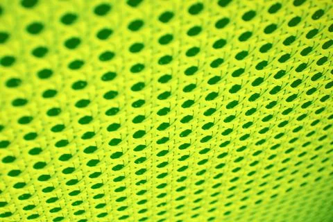 Neon lime colored abstract pattern with holes and lines Stock Photos