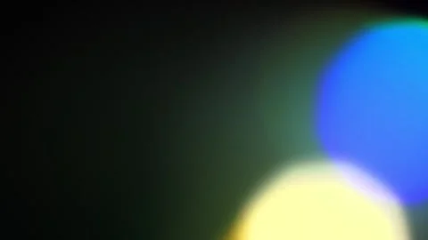 Neon rainbow light leaks and bokeh loop forwards and reverse on black Stock Footage 344579239