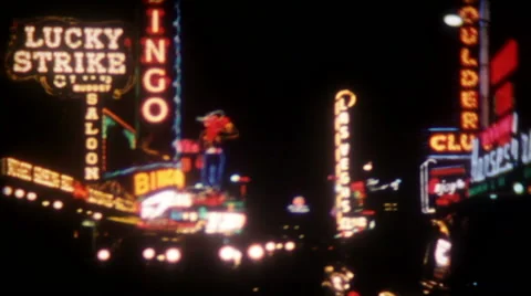Neon shines at night in downtown Las Vegas 1950s vintage film home movie 1380 Stock Footage