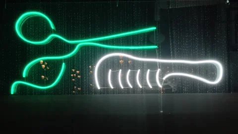 A neon sign with a pair of scissors on it, ideal for use in creative projec.. Stock Footage 344796230