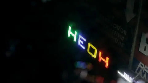 Neon sign in the reflection in a puddle Stock Footage 71246769