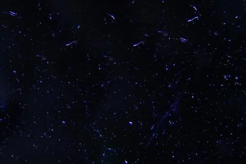 Neon splashes and small dots on a black background Stock Photos