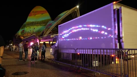 Neon Sydney Harbour Bridge reflected on a lorry at the Opera House 6K Video stock 330511290