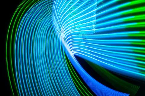 Neon technology stripes. Digital blue and green lines on black background. Stock Illustration