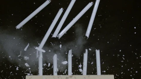 Neon tubes falling after shooting, Ultra Slow Motion Stock Footage 86584451