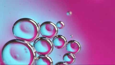 Neon ultraviolet and blue gradient. Macro oil drop in water Stock Footage 114815501