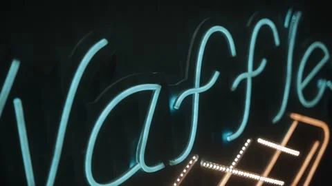 Neon Waffles Sign Glows at Night Stock Footage 341755348