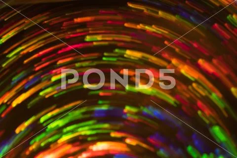 Neon whirl lines lens flare blur defocused light Stock Photos