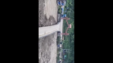 Nepal: Dramatic Video Shows Bridge Collapse as Flash Flood Sweeps Through... Stock Footage 343623980