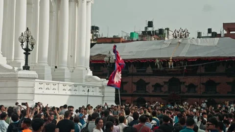 Nepal Flag and Crowd at Indra Jatra Festival in Kathmandu Durbar Square Stock Footage 317872970