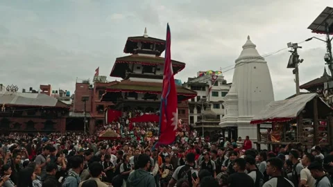 Nepal Flag and Crowd at Indra Jatra Festival in Kathmandu Durbar Square Stock Footage 317873539