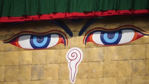Nepal. Front close up view Buddhas eyes and buddhist prayer flags. Stock Footage 140437751
