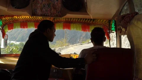 Nepal- front window of a loud bus speeding downhill Stock Footage 95942237