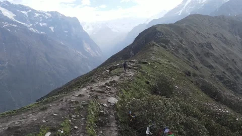Nepal Himalayas Man Running on Mountain ridge circling 360, 4K Drone Stock Footage 204879015