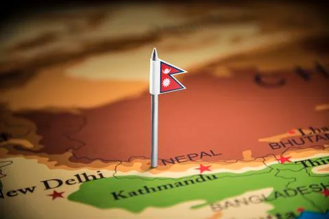 Nepal marked with a flag on the map Stock Photos